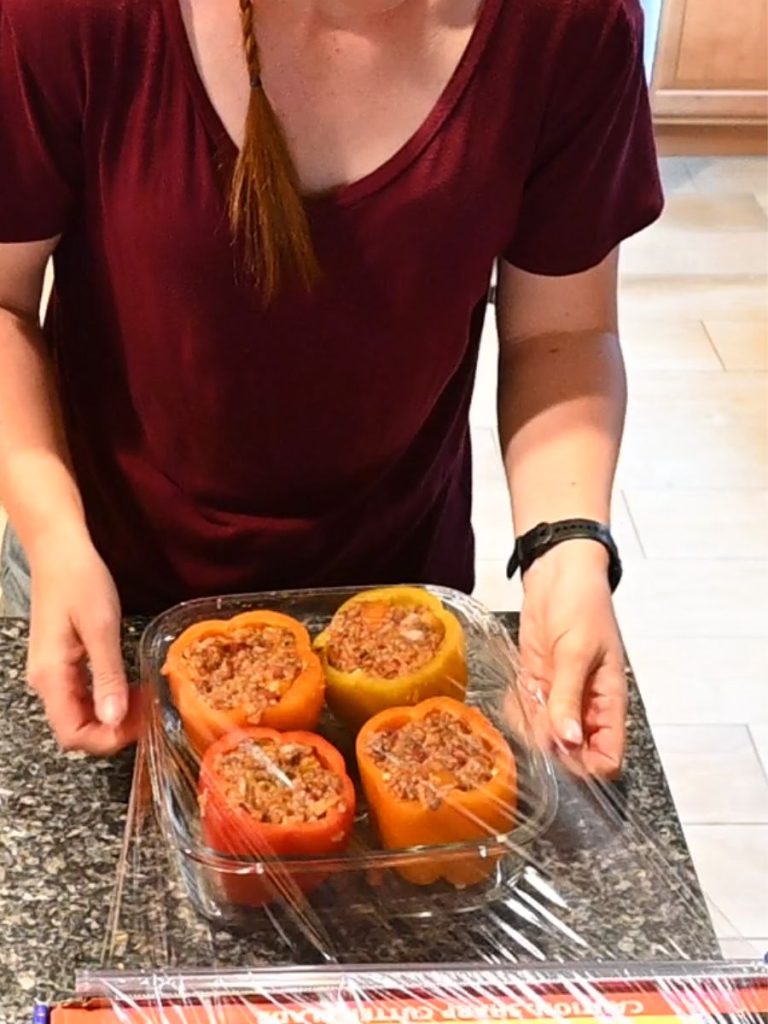 stuffed bell peppers wrapped in plastic wrap