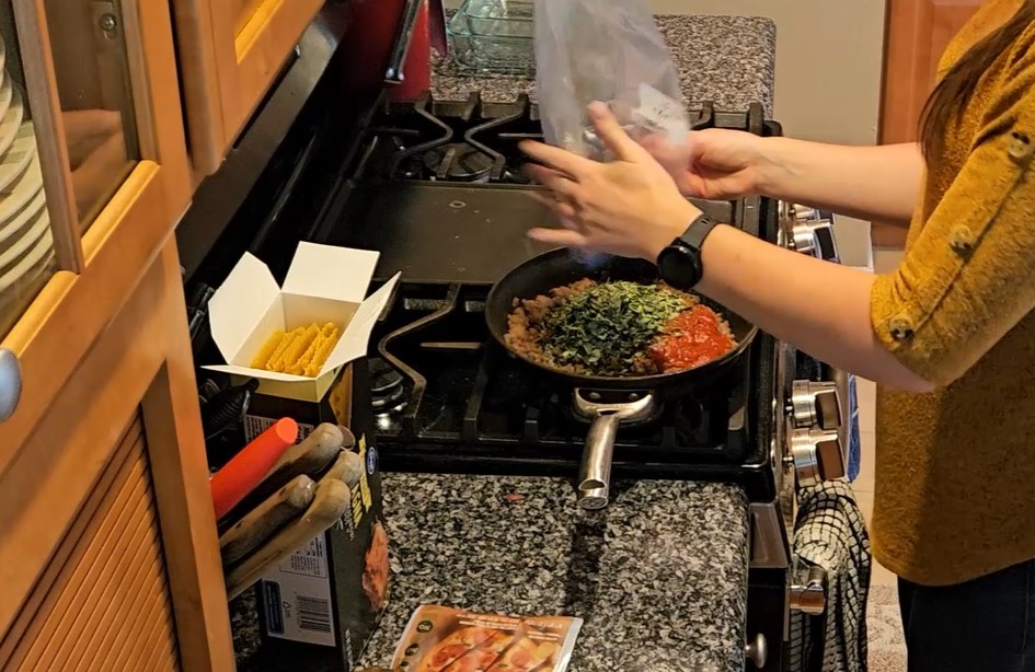 dried-kale-going-into-meat-pasta-sauce