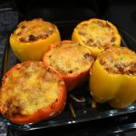 cooked stuffed bell peppers with golden cheese