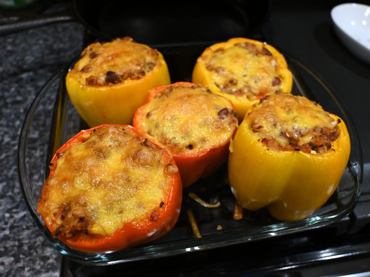 cooked stuffed bell peppers with golden cheese