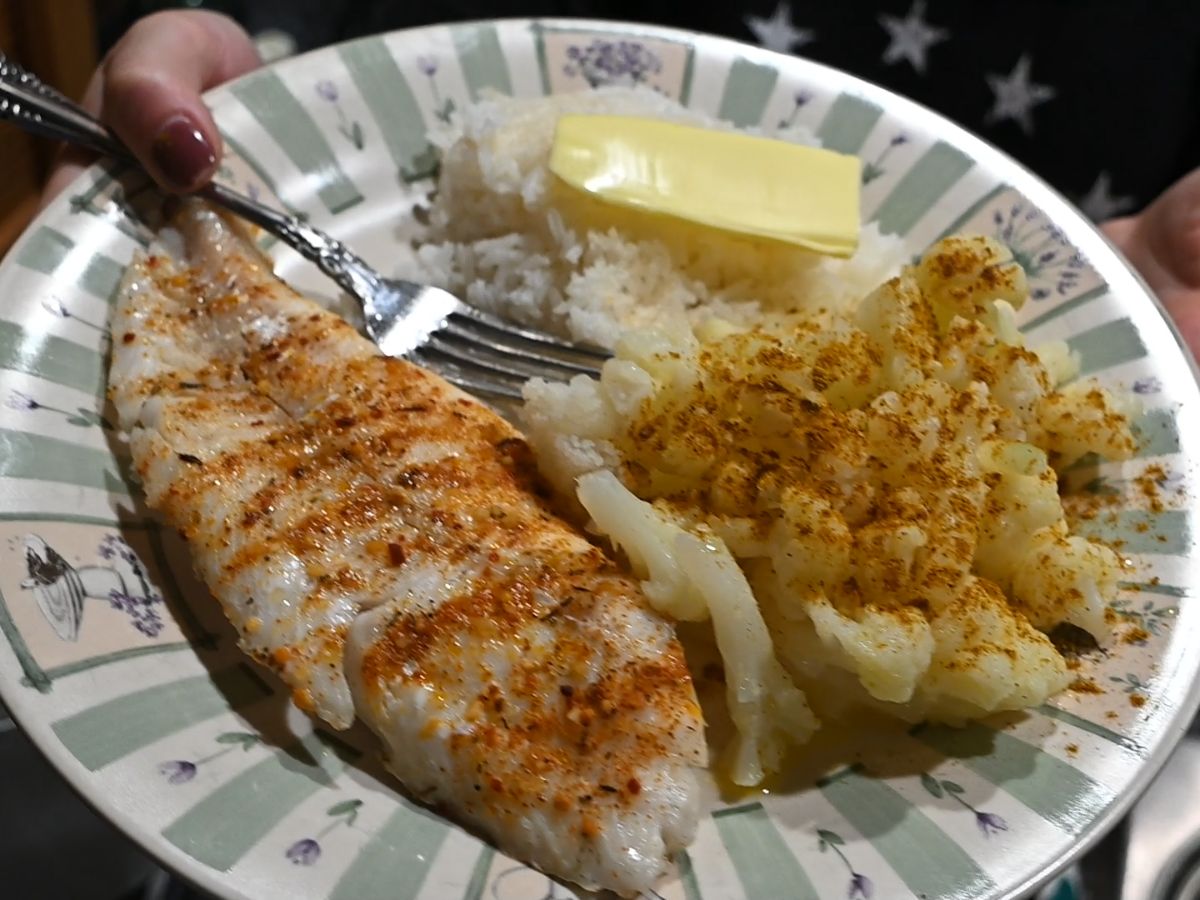 easy dinner baked walleye with cauliflower and rice on a plate