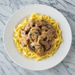 beef stroganoff on eggs noodles